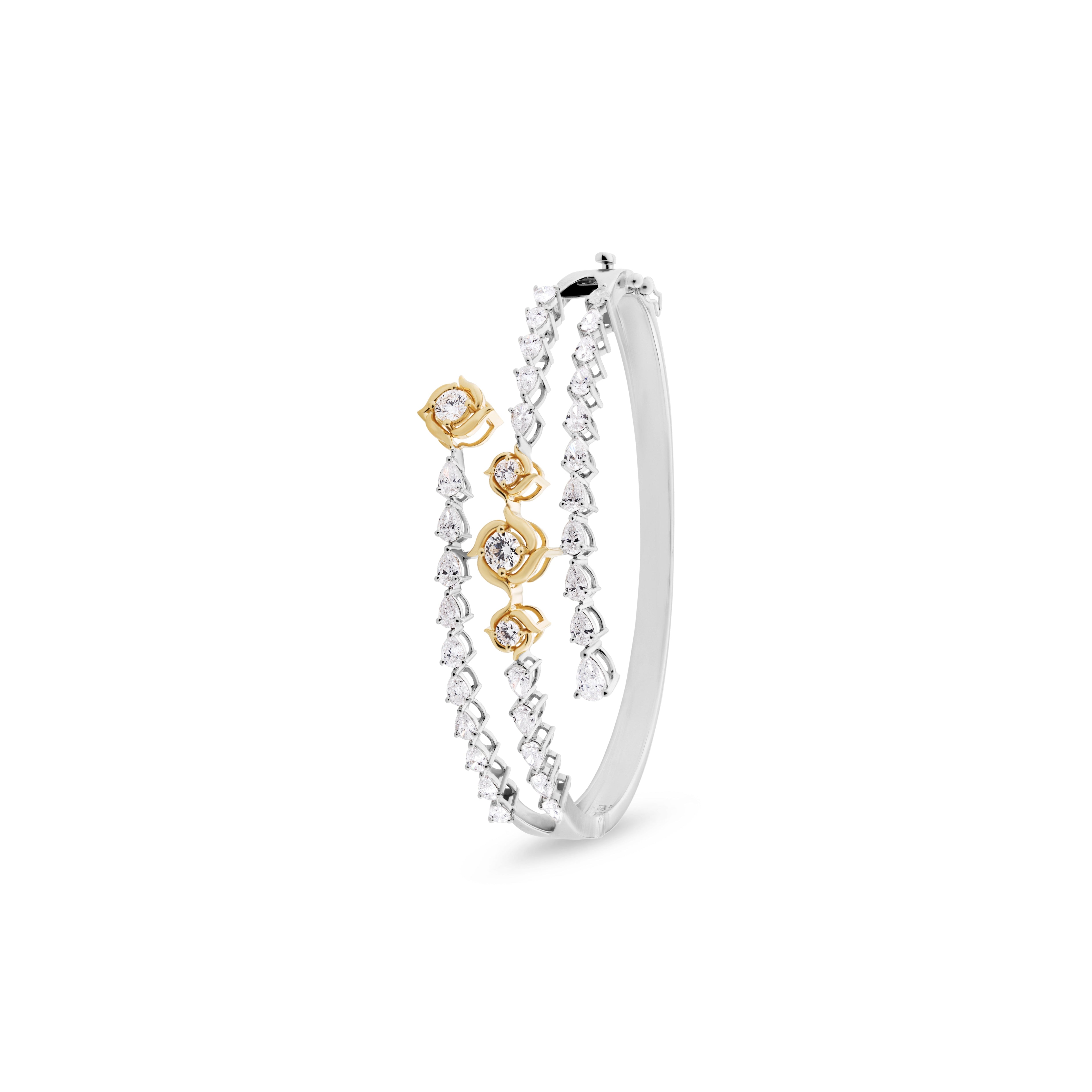 Silver hoop earring with gold accents on a white background