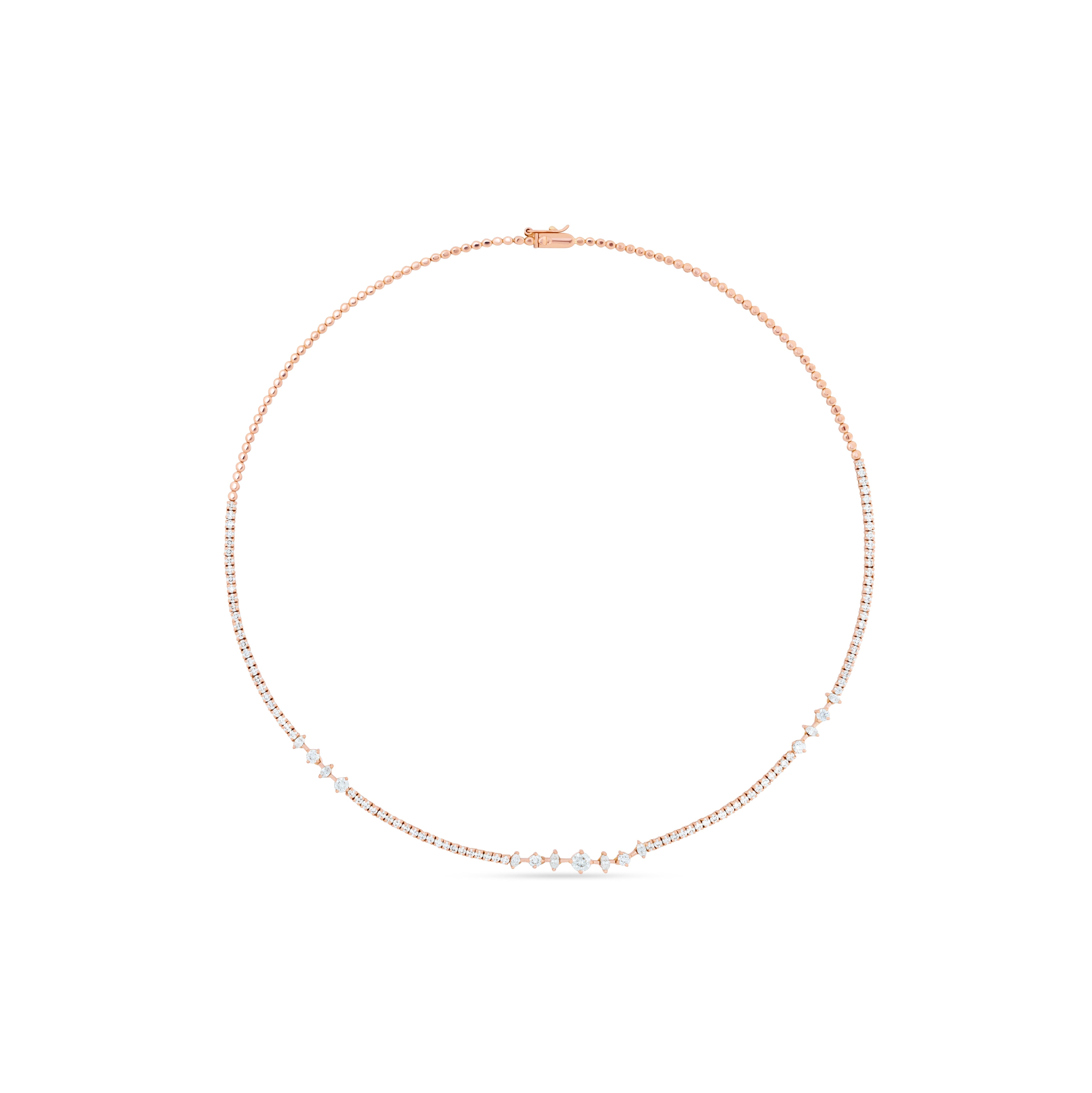 Rose gold necklace with small diamonds on a white background