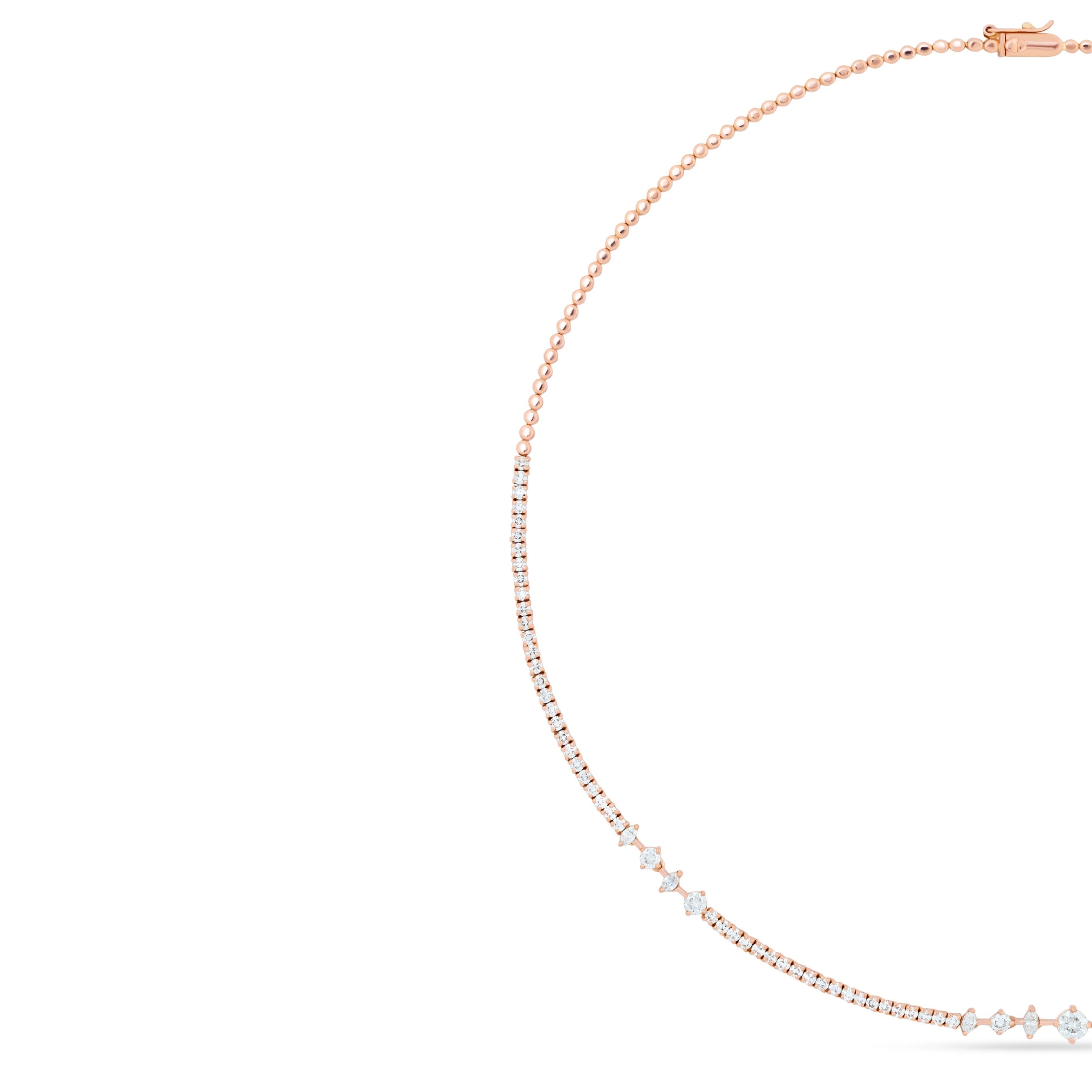 Rose gold necklace with small diamonds on a white background