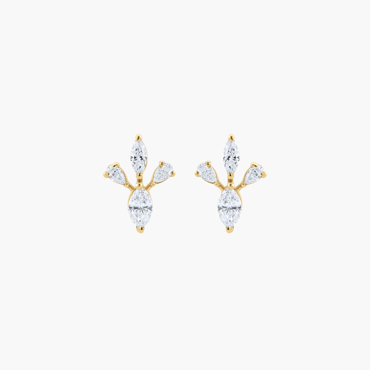 Gold and diamond earrings on a white background