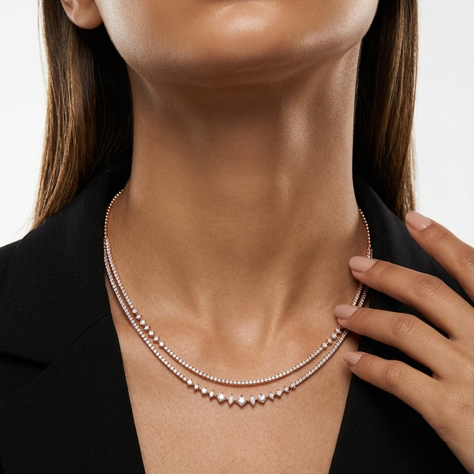 Close-up of a woman wearing a pearl necklace with a blurred background