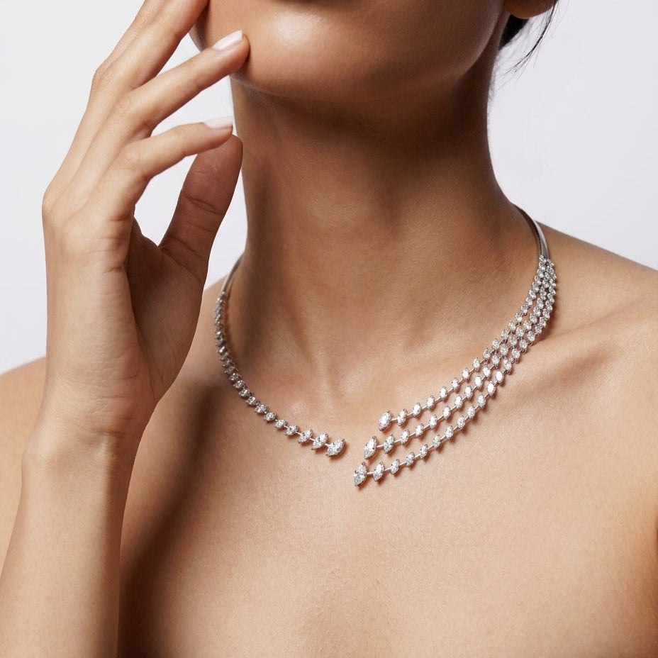 Pearl necklace worn by a model against a neutral background