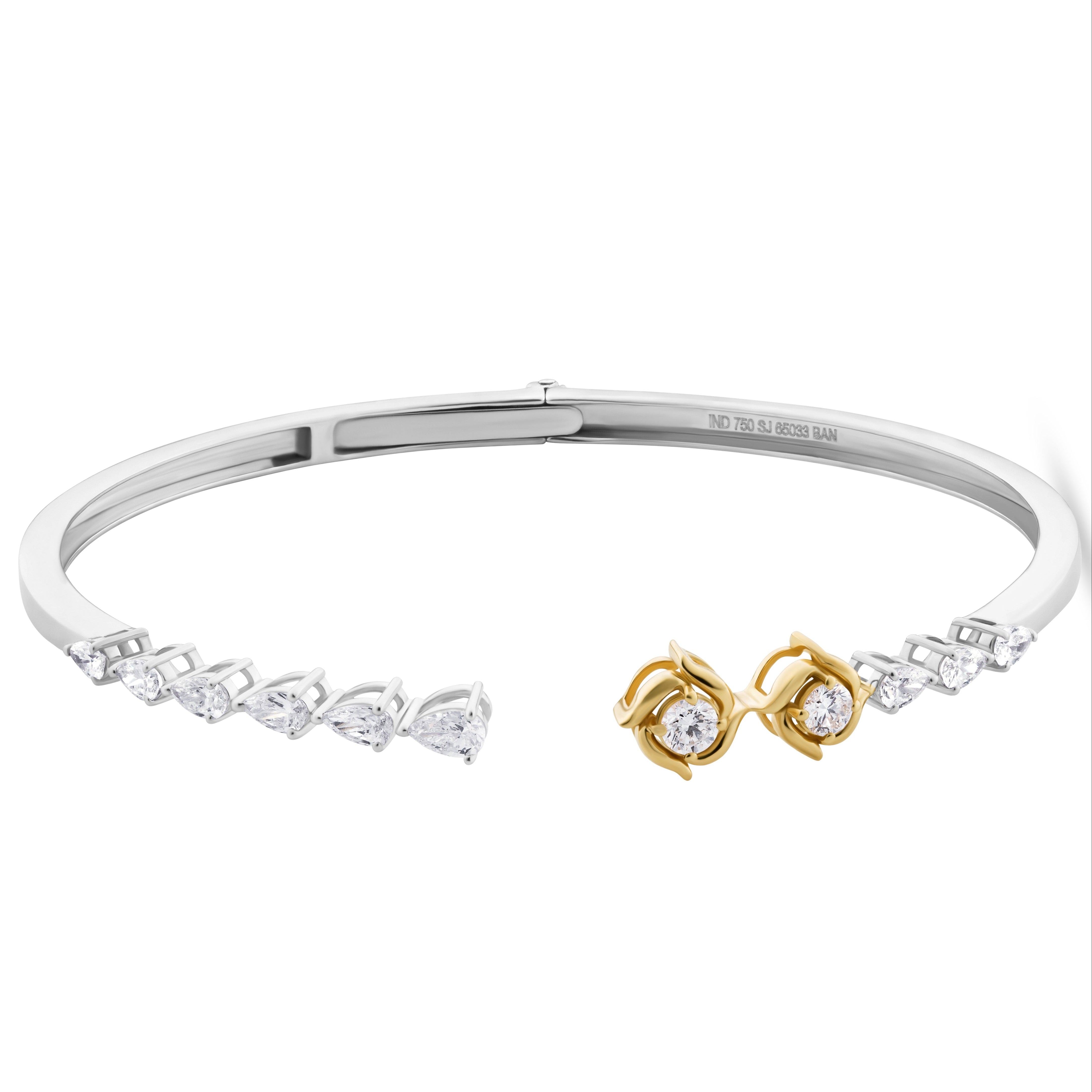 Silver bracelet with gold accents on a white background