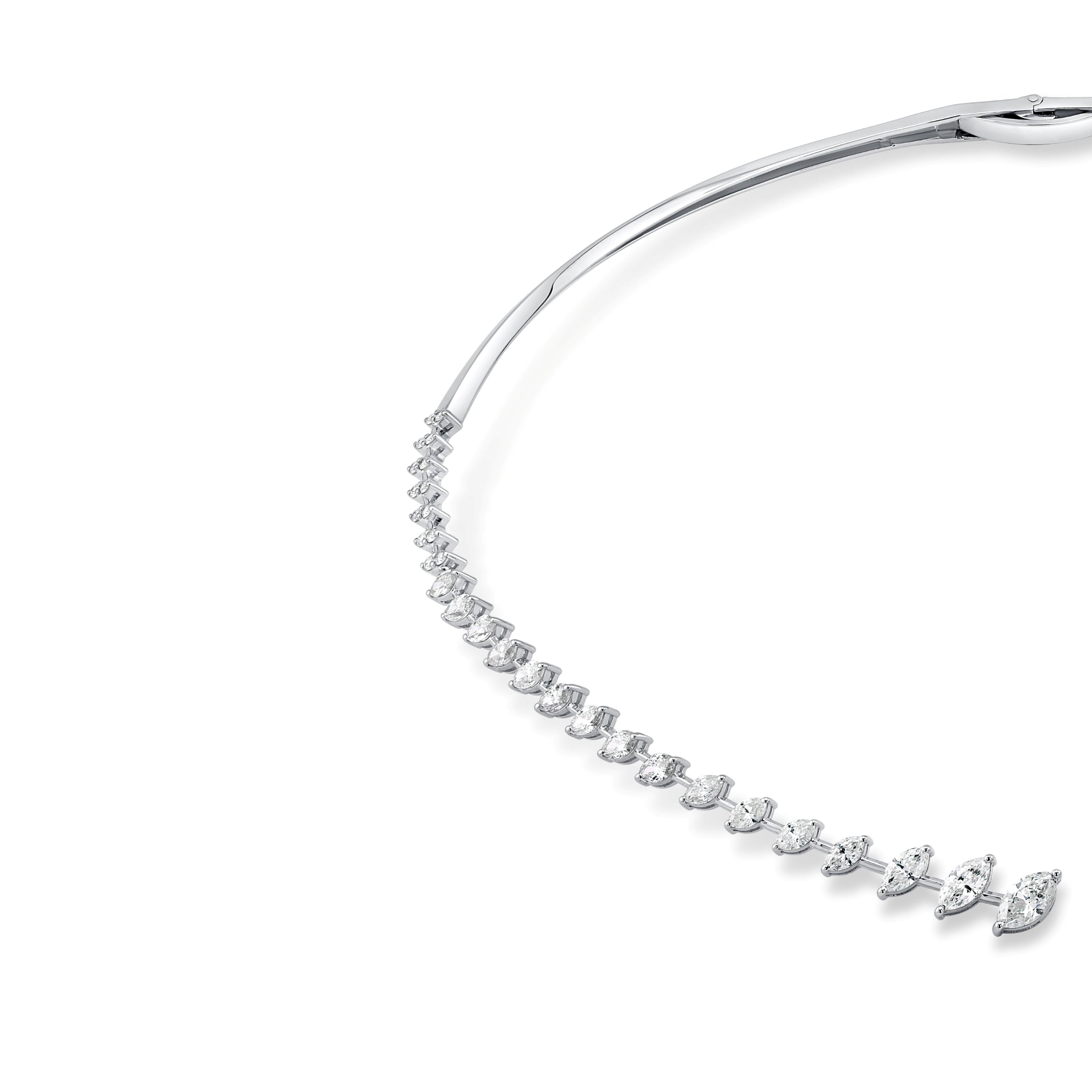 Gold necklace with clear gemstones on a white background