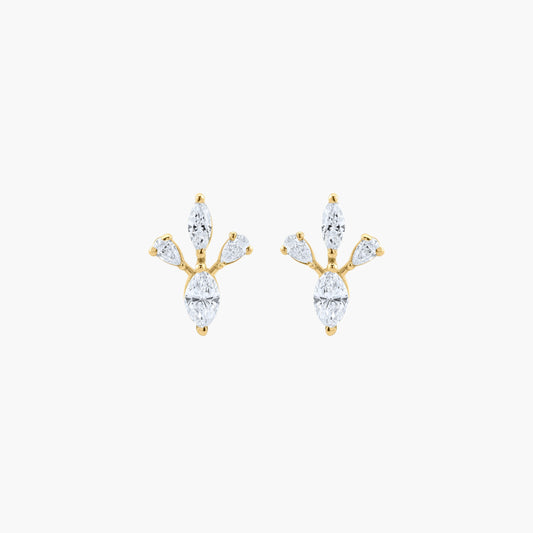 Gold and diamond earrings on a white background